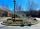 Well-maintained street view with beautiful landscaping and clear signage for residents at 2428 Crescent Park Ct, Atlanta, GA 30339