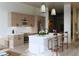 Modern kitchen features sleek cabinets, stainless steel appliances, island with breakfast bar, and pendant lighting at 567 Ponce De Leon Ne Ave # 614, Atlanta, GA 30308