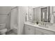 Bathroom featuring a double vanity and shower and bathtub combo at 685 Stickley Oak Way, Woodstock, GA 30189