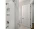 This bathroom features a tiled shower with built-in niche, adding both style and functionality to the space at 685 Stickley Oak Way, Woodstock, GA 30189