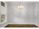 Bright dining room with hardwood floors and modern light fixture at 685 Stickley Oak Way, Woodstock, GA 30189