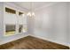 Dining room featuring hardwood floors and a modern light fixture at 685 Stickley Oak Way, Woodstock, GA 30189