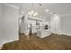 Open-concept kitchen with stainless steel appliances and hardwood floors at 685 Stickley Oak Way, Woodstock, GA 30189