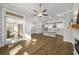 Open-concept living space with hardwood floors and lots of natural light at 685 Stickley Oak Way, Woodstock, GA 30189