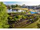 Aerial view of a community park featuring a pond, green space, walking paths, and recreational areas at 115 Arcadia Ave, Fayetteville, GA 30214