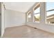 Bedroom with high ceilings, many windows and natural light, and hardwood floors at 115 Arcadia Ave, Fayetteville, GA 30214