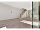 Bright, open-concept living room with hardwood floors, modern staircase, and natural light at 115 Arcadia Ave, Fayetteville, GA 30214