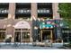 Charming storefronts of Woodstone Bakery and The Funky Shack Mercantile, with inviting outdoor seating at 115 Arcadia Ave, Fayetteville, GA 30214