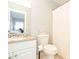 Bathroom with vanity, toilet, and shower featuring a white shower curtain at 1205 Trey Ct, Marietta, GA 30064