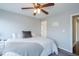 Bedroom featuring a bed, a window with blinds, and a ceiling fan at 1205 Trey Ct, Marietta, GA 30064