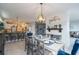 Open-concept dining room features a dining table set for a meal with a view of the kitchen at 1205 Trey Ct, Marietta, GA 30064