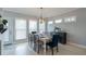 Formal dining room with a dining table set for ten under an elegant lighting fixture at 1205 Trey Ct, Marietta, GA 30064