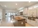 Open kitchen with a butcher block island, stainless steel sink, and ample cabinetry space at 1205 Trey Ct, Marietta, GA 30064