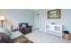 Inviting living room with a cozy armchair, a white cabinet, and hardwood floors at 1205 Trey Ct, Marietta, GA 30064