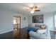 Living room with hardwood floors, a ceiling fan, and comfortable seating at 1205 Trey Ct, Marietta, GA 30064