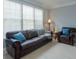 Comfortable living room featuring a plush sofa, window, and cozy decor at 1205 Trey Ct, Marietta, GA 30064