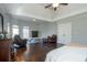 Primary bedroom featuring hardwood floors, tray ceiling, and decorative dresser and seating at 1205 Trey Ct, Marietta, GA 30064