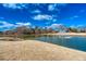 Scenic pond view with fountain under a bright blue sky with clouds at 1205 Trey Ct, Marietta, GA 30064