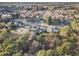 Aerial view of the neighborhood with mature trees and different architectural home styles at 128 Graybrook Ct, Grayson, GA 30017