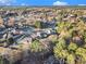 Aerial view of the neighborhood, showcasing tree coverage and highlighting the proximity of the homes to each other at 128 Graybrook Ct, Grayson, GA 30017