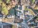 Birds eye view shows a home with a large, private backyard, long driveway, and lush landscaping and mature trees at 128 Graybrook Ct, Grayson, GA 30017