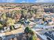 An elevated shot showcases this charming home and its surrounding neighborhood full of lush trees and mature landscaping at 128 Graybrook Ct, Grayson, GA 30017