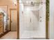 Bathroom featuring a modern shower with white tiled walls, rainfall showerhead, and glass door at 128 Graybrook Ct, Grayson, GA 30017