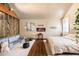 Vaulted ceiling bedroom with a comfy sofa, electric fireplace, and views from the windows at 128 Graybrook Ct, Grayson, GA 30017