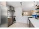 Bright kitchen featuring modern appliances, ample counter space, and tiled backsplash at 128 Graybrook Ct, Grayson, GA 30017