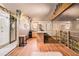 This kitchenette offers an eat in counter, wood floors and a view through a glass paneled wall at 128 Graybrook Ct, Grayson, GA 30017