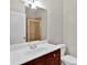 Well-lit bathroom featuring a white vanity, modern sink, and glass-enclosed shower at 1690 Mosaic Way, Smyrna, GA 30080