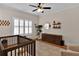 Charming Bedroom with plantation shutters, modern dresser, and geometric patterned rug at 1690 Mosaic Way, Smyrna, GA 30080