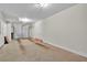 Empty garage with a garage door, concrete floor, and lighting at 1690 Mosaic Way, Smyrna, GA 30080