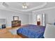 Lovely main bedroom featuring a blue patterned bedspread and an en-suite bathroom at 1690 Mosaic Way, Smyrna, GA 30080