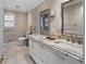 Bathroom with double sinks, a vanity with marble countertop, large mirrors, and great lighting at 19 Roving Rd, Cartersville, GA 30121