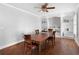 Dining room features a wooden table, hardwood floors, built-in bookshelves, and bright windows at 19 Roving Rd, Cartersville, GA 30121