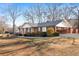 A brick house with a nice yard and covered parking area next to the house at 19 Roving Rd, Cartersville, GA 30121