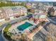 Aerial view of neighborhood community pool with townhomes at 2102 Monhegan Se Way # 2102, Smyrna, GA 30080