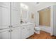 Clean, white bathroom featuring a tub/shower combo, storage cabinets, and neutral finishes at 2102 Monhegan Se Way # 2102, Smyrna, GA 30080