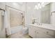 Bathroom featuring neutral tile, shower-tub combo, and white vanity at 2102 Monhegan Se Way # 2102, Smyrna, GA 30080