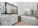 A bathroom is shown, featuring a tub and vanity area with nice tile work at 2102 Monhegan Se Way # 2102, Smyrna, GA 30080