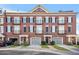 Beautiful three-story brick townhome with black shutters, iron balconies, and a two-car garage at 2102 Monhegan Se Way # 2102, Smyrna, GA 30080