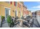 Outdoor patio with stylish seating, decorative rug, and views of neighboring townhomes at 2102 Monhegan Se Way # 2102, Smyrna, GA 30080