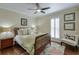 Cozy bedroom with hardwood floors, shuttered windows, and stylish decor at 8720 Rhapsody Ln, Cumming, GA 30041