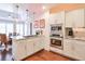 Spacious kitchen featuring granite countertops, stainless steel appliances, and ample cabinet space at 8720 Rhapsody Ln, Cumming, GA 30041