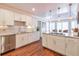 Kitchen with granite countertops, stainless steel appliances and hardwood floors, and large island at 8720 Rhapsody Ln, Cumming, GA 30041