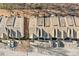 Aerial view of well-maintained townhomes with assigned parking spaces and landscaping at 1331 Penhurst Dr, Lawrenceville, GA 30043