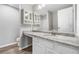 Well-lit bathroom featuring a granite vanity top, stylish cabinets, and sleek, modern fixtures at 1331 Penhurst Dr, Lawrenceville, GA 30043