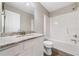 Bathroom featuring white cabinets, modern shower, and solid surface vanity at 1331 Penhurst Dr, Lawrenceville, GA 30043