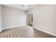 Bedroom featuring neutral walls, wood look flooring, and sliding patio door at 1331 Penhurst Dr, Lawrenceville, GA 30043